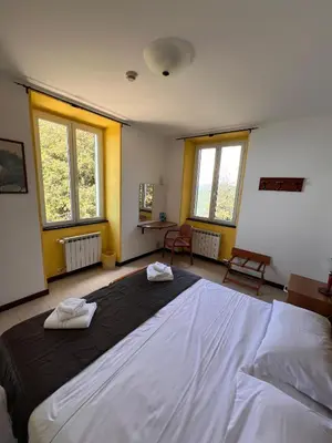 Letto o letti in una camera di Hotel Montallegro