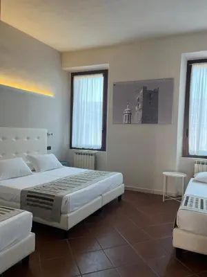 Letto o letti in una camera di Residenza Accademia, MantegnaHotels