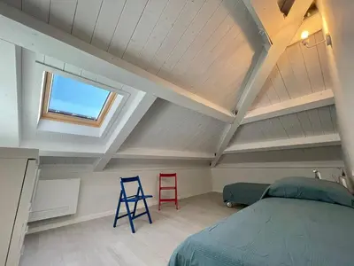 Letto o letti in una camera di Casa Roma