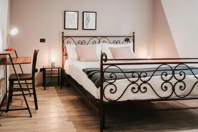 Letto o letti in una camera di Tra le case di Reggio - Passo Buole