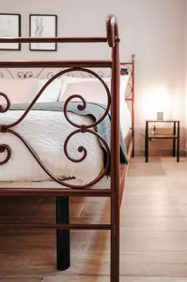 Letto o letti in una camera di Tra le case di Reggio - Passo Buole
