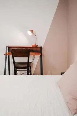Letto o letti in una camera di Tra le case di Reggio - Passo Buole