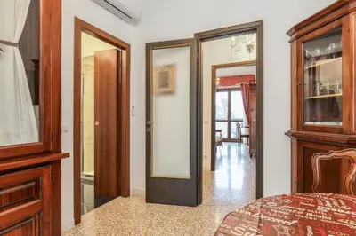 Letto o letti in una camera di SUITE ANGOLO ALLA STAZIONE - Appartamento con terrazzo panoramico