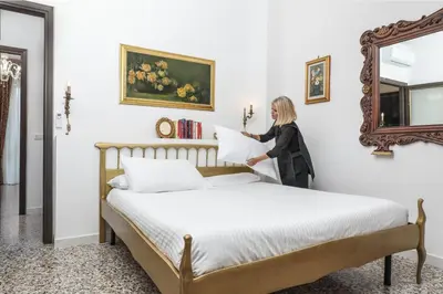 Letto o letti in una camera di SUITE ANGOLO ALLA STAZIONE - Appartamento con terrazzo panoramico