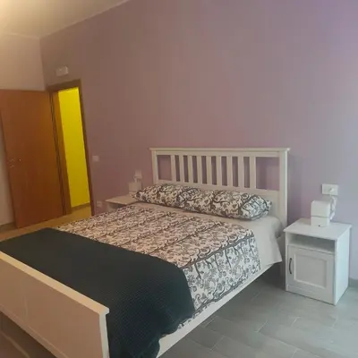 Letto o letti in una camera di B&B Canossalpaca