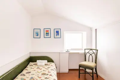 Letto o letti in una camera di Casa Elvira - Centro storico sul mare a Rapallo