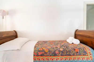 Letto o letti in una camera di Casa Elvira - Centro storico sul mare a Rapallo