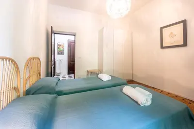 Letto o letti in una camera di GuestHost - Borgo Bliss in Parma's San Giuseppe District