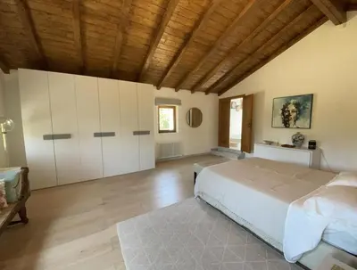 Letto o letti in una camera di Casale del Pozzo-Villa with pool - Fosdinovo in the borgo of Pulica