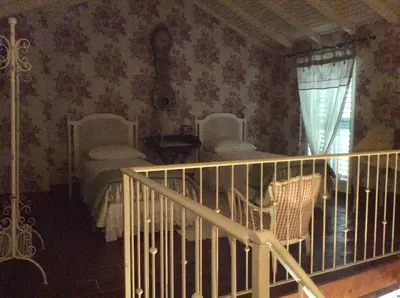 Letto o letti in una camera di Aria di Campagna