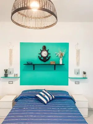 Letto o letti in una camera di Il Nido sullo Scoglio