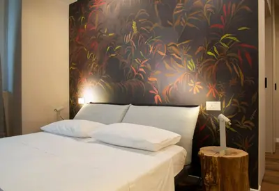 Letto o letti in una camera di San Benedetto Rooms