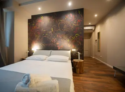 Letto o letti in una camera di San Benedetto Rooms