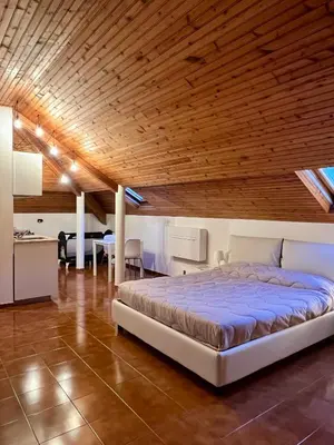 Letto o letti in una camera di CASTAGNETO 8