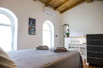 Letto o letti in una camera di La CASETTA Antica dimora nel centro storico