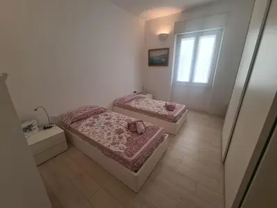 Letto o letti in una camera di La Casa del Centro by PortofinoVacanze