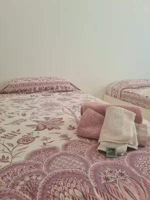 Letto o letti in una camera di La Casa del Centro by PortofinoVacanze