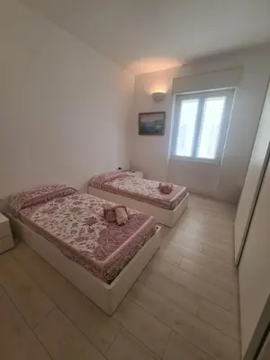 Letto o letti in una camera di La Casa del Centro by PortofinoVacanze