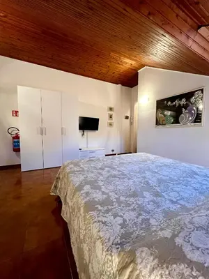 Letto o letti in una camera di CASTAGNETO 11