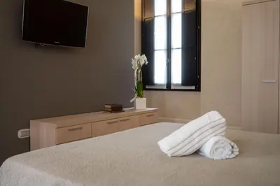 Letto o letti in una camera di Le Residenze di Mantova