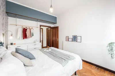 Letto o letti in una camera di CASA EMILIA - * In the HEART of MODENA *