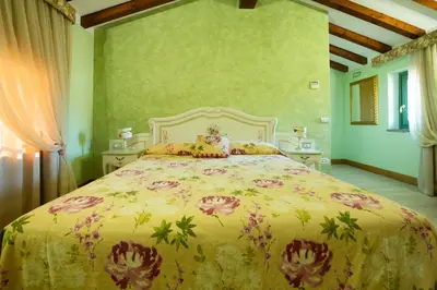 Letto o letti in una camera di La Corte San Lorenzo