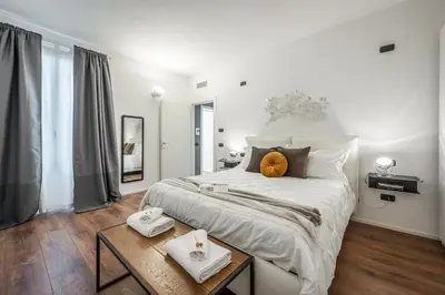 Letto o letti in una camera di RESIDENZA BELLA VITA, eleganza in centro