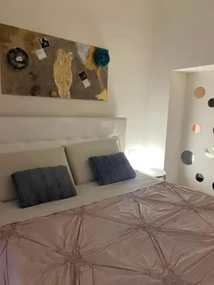 Letto o letti in una camera di BORGO DEGLI STUDI 7
