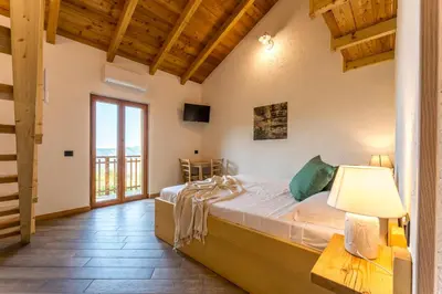 Letto o letti in una camera di Casa Aurora