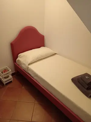 Letto o letti in una camera di Dolce Casa da Roby e Andrea by PortofinoVacanze