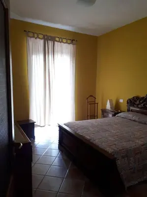 Letto o letti in una camera di Casa Assunta