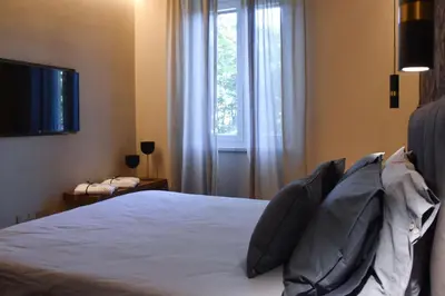 Letto o letti in una camera di Nuova Cafe' Suite