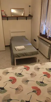 Letto o letti in una camera di Casa Romeo