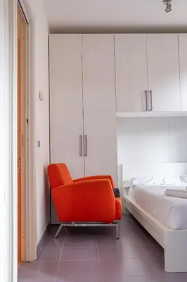 Letto o letti in una camera di Casa Moro, monolocale moderno nel centro storico