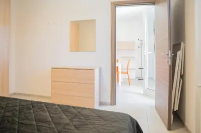 Letto o letti in una camera di 044b - Villetta Moderna 01-24D con VASCA IDROMASSAGGIO in giardino, solo 15 minuti dal Mare e Spiaggia - Posto Auto GRATUITO