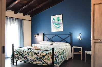 Letto o letti in una camera di Affittacamere Borgo degli Artisti boutique rooms