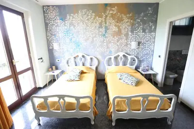 Letto o letti in una camera di B & B L'almanacco