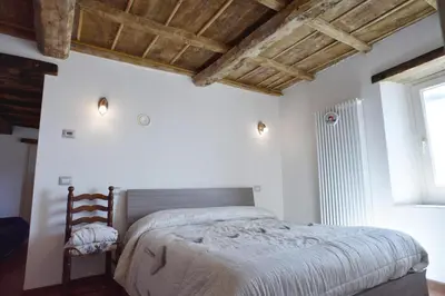 Letto o letti in una camera di Appartamento da Vinci - Appartamento Masaccio