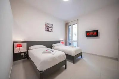 Letto o letti in una camera di [RUA MURO] Piano Nobile Family
