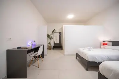 Letto o letti in una camera di [RUA MURO] Piano Nobile Family