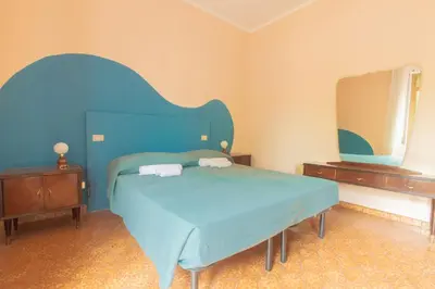 Letto o letti in una camera di Casa Vinicia