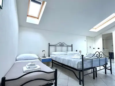 Letto o letti in una camera di La Spezia Vezzano 5 terre - Il Ciliegio