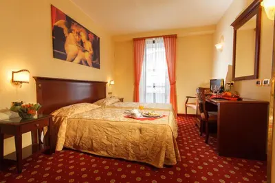 Letto o letti in una camera di Hotel Mistrello di Savoia