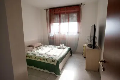 Letto o letti in una camera di Affittacamere Ortensia