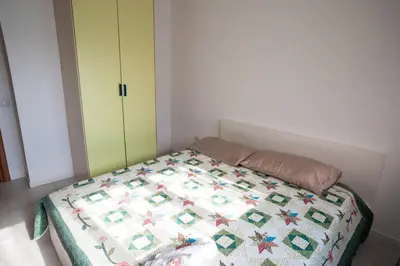 Letto o letti in una camera di Affittacamere Ortensia