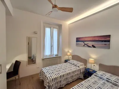 Letto o letti in una camera di SIMARE - 2 camere matrimoniali a 500metri da stazione e spiaggia