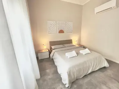 Letto o letti in una camera di SUITE Celeste - 2 Bagni e 2 Camere da Letto