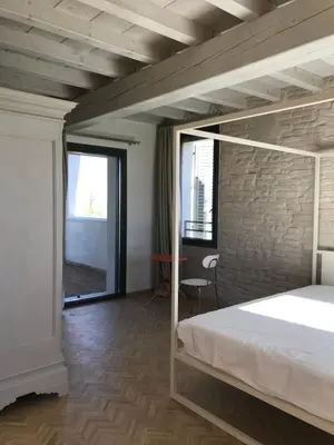 Letto o letti in una camera di Corte LOIOL