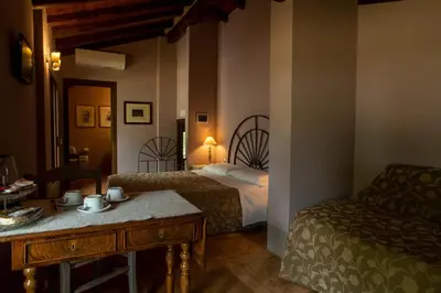 Letto o letti in una camera di La Finestra sul Po - Agriturismo