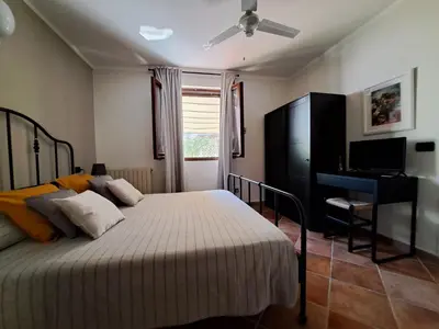 Letto o letti in una camera di B&B Tenuta Campo Magliano